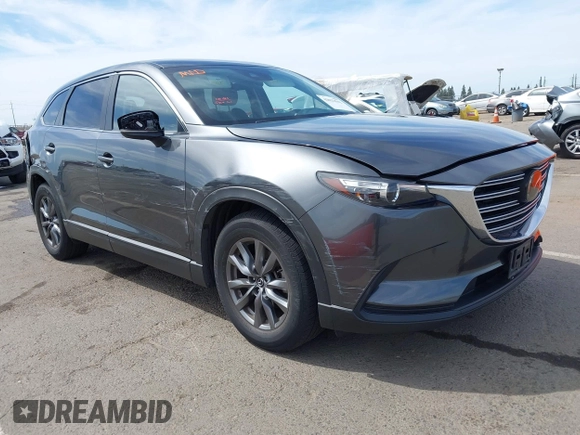 2021 Mazda CX-9 Sport with VIN JM3TCBBY7M0520437, listed as a IAAI auction lot 42022562 with 77,063 mi miles and . Bid and sale history available at DreamBid. Image 1.