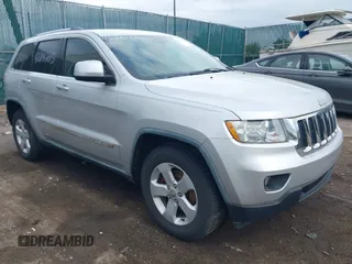 2011 Jeep Grand Cherokee Laredo with VIN 1J4RR4GG0BC622732, listed as a IAAI auction lot 42218785 with 127,186 mi miles and . Bid and sale history available at DreamBid. Image 1.