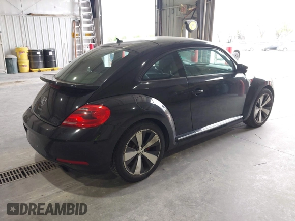 2012 Volkswagen Beetle 2.0T Turbo w/Sun/Snd/Nav PZEV with VIN 3VWVA7AT8CM617830, listed as a IAAI auction lot 42024546 with 91,688 mi miles. Bid and sale history available at carsss.com. Image 4.