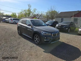 2017 BMW X1 xDrive28i with VIN WBXHT3C32H5F79305, listed as a Copart auction lot 54665865 with 113,046 mi miles and Clean Title. Bid and sale history available at carsss.com. Image 1.