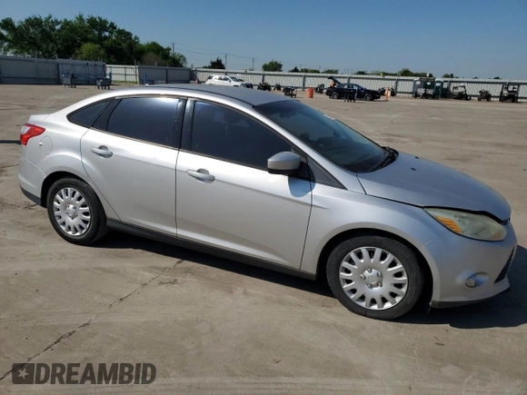 2012 Ford Focus SE z VIN 1FAHP3F23CL174243, wystawiony jako Copart lot #52247595 z przebiegiem 164 383 mil mil oraz Czysty tytuł • Clean title. Historia ofert i sprzedaży dostępna na DreamBid. Obrazek 4.
