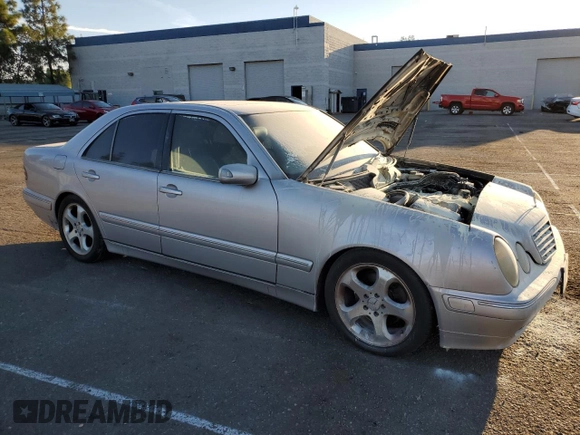 2002 Mercedes-Benz E-Class with VIN WDBJF65J32B496411, listed as a Copart auction lot 75690884 with 128,855 mi miles and Salvage Title. Bid and sale history available at carsss.com. Image 4.