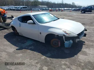 2014 Nissan 370Z with VIN JN1AZ4EH8EM634403, listed as a IAAI auction lot 41923568 with 137,676 mi miles. Bid and sale history available at carsss.com. Image 1.