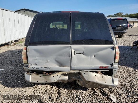 1999 GMC Denali z VIN 1GKEK13R4XR918005, wystawiony jako Copart lot #74964184 z przebiegiem 206 584 mil mil oraz Nie do naprawy. Historia ofert i sprzedaży dostępna na DreamBid. Obrazek 6.