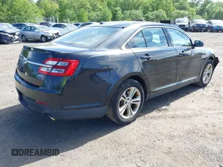 2015 Ford Taurus SEL with VIN 1FAHP2E88FG181055, listed as a IAAI auction lot 42307640 with 104,702 mi miles and . Bid and sale history available at DreamBid. Image 4.