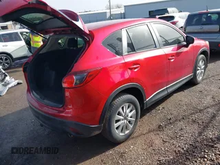 2016 Mazda CX-5 Sport with VIN JM3KE2BY3G0754391, listed as a IAAI auction lot 41719461 with 79,130 mi miles. Bid and sale history available at carsss.com. Image 4.