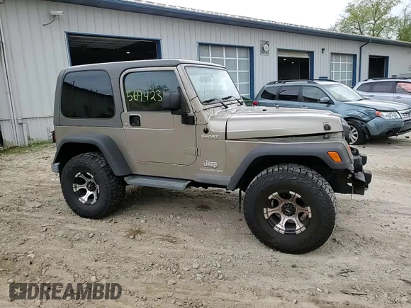 2005 Jeep Wrangler Sport z VIN 1J4FA49S75P325028, wystawiony jako Copart lot #56942315 z przebiegiem 169 988 mil mil oraz Szkoda całkowita • Salvage title. Historia ofert i sprzedaży dostępna na DreamBid. Obrazek 13.