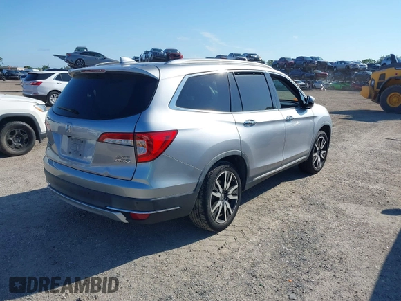 2019 Honda Pilot Elite with VIN 5FNYF6H00KB001016, listed as a IAAI auction lot 42583325 with 133,327 mi miles and . Bid and sale history available at DreamBid. Image 4.