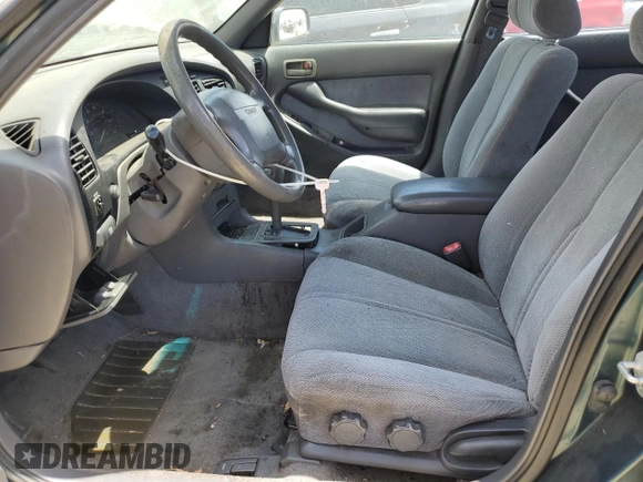 1996 Toyota Camry LE with VIN 4T1BF12K5TU861825, listed as a Copart auction lot 59803174 with 217,650 mi miles and Salvage title. Bid and sale history available at DreamBid. Image 7.
