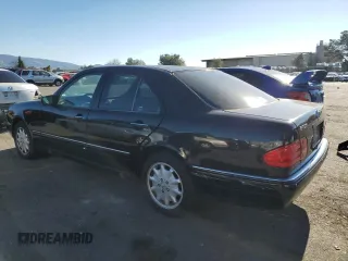 1997 Mercedes-Benz E-Class with VIN WDBJF55F4VJ034892, listed as a Copart auction lot 89406595 with 118,494 mi miles and Salvage Title. Bid and sale history available at carsss.com. Image 2.