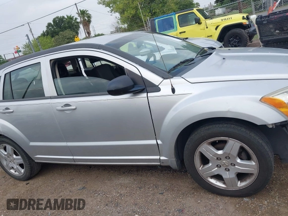 2009 Dodge Caliber SXT with VIN 1B3HB48A59D143888, listed as a IAAI auction lot 42110334 with 182,674 mi miles and . Bid and sale history available at DreamBid. Image 14.