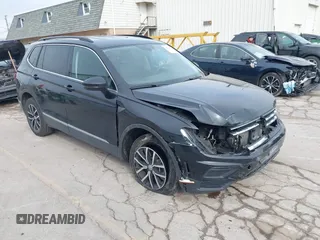 2021 Volkswagen Tiguan SE with VIN 3VV2B7AXXMM057849, listed as a IAAI auction lot 41879768 with 88,353 mi miles and . Bid and sale history available at DreamBid. Image 1.