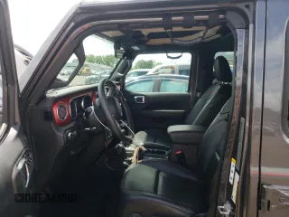 2018 Jeep Wrangler Unlimited Rubicon with VIN 1C4HJXFG1JW261472, listed as a Copart auction lot 63259345 with 60,457 mi miles and Salvage title. Bid and sale history available at DreamBid. Image 7.