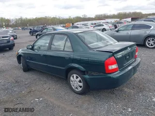 1999 Mazda Protege DX with VIN JM1BJ2226X0152861, listed as a IAAI auction lot 42008276 with 63,152 mi miles. Bid and sale history available at carsss.com. Image 3.