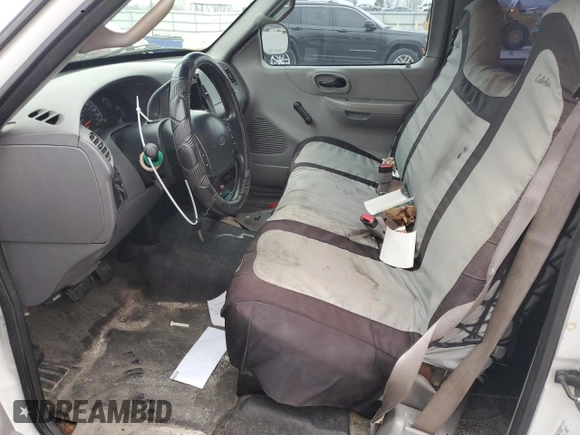 2000 Ford F-150 XL с VIN 1FTZX1725YNB58607, выставлен на аукционе Copart как лот 48706575 с пробегом 286 898 миль миль и Списание • Salvage title. История ставок и продаж доступна на DreamBid. Изображение 7.