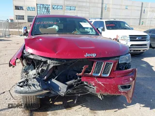 2015 Jeep Grand Cherokee Summit with VIN 1C4RJEJG9FC100568, listed as a IAAI auction lot 42512705 with 128,413 mi miles and . Bid and sale history available at DreamBid. Image 12.