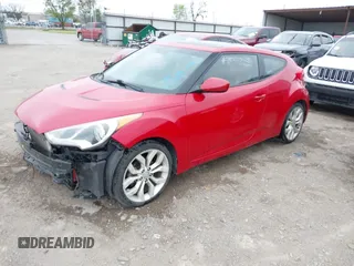 2013 Hyundai Veloster w/Gray Int z VIN KMHTC6AD8DU146035, wystawiony jako IAAI lot #41892703 z przebiegiem 241 169 mil mil oraz . Historia ofert i sprzedaży dostępna na DreamBid. Obrazek 2.