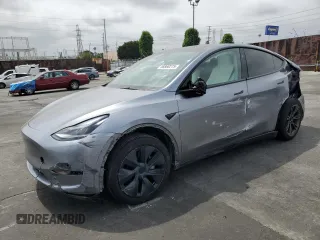 2024 Tesla Model Y with VIN 7SAYGDED6RA314039, listed as a Copart auction lot 58868275 with 10,002 mi miles and Salvage title. Bid and sale history available at DreamBid. Image 1.