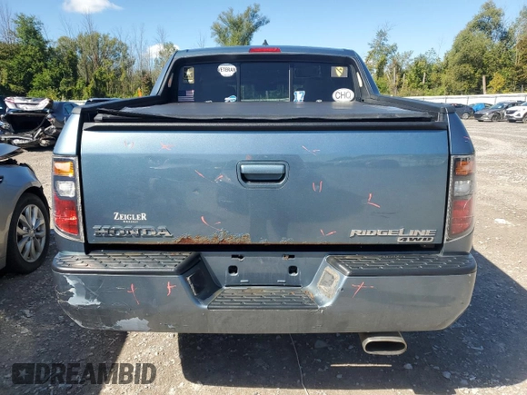 2006 Honda Ridgeline RTL with VIN 2HJYK16556H545357, listed as a Copart auction lot 70656694 with 153,668 mi miles and Salvage Title. Bid and sale history available at carsss.com. Image 6.