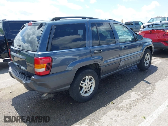 2004 Jeep Grand Cherokee Laredo with VIN 1J4GX48S44C205469, listed as a IAAI auction lot 42310571 with 154,929 mi miles and . Bid and sale history available at DreamBid. Image 4.