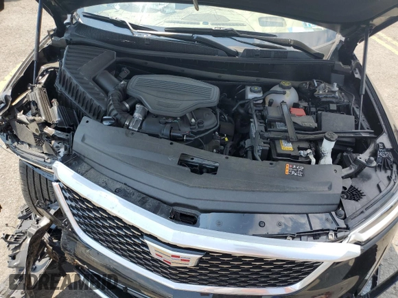 2023 Cadillac XT6 AWD Premium Luxury z VIN 1GYKPFRS7PZ225950, wystawiony jako Copart lot #65573174 z przebiegiem Nie podano mil oraz Szkoda całkowita • Salvage title. Historia ofert i sprzedaży dostępna na DreamBid. Obrazek 13.