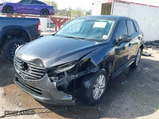 2016 Mazda CX-5 Touring with VIN JM3KE4CY3G0672977, listed as a IAAI auction lot 41889137 with 130,593 mi miles. Bid and sale history available at carsss.com. Image 18.