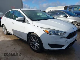 2018 Ford Focus SE z VIN 1FADP3F20JL225225, wystawiony jako IAAI lot #42678875 z przebiegiem 120 605 mil mil oraz . Historia ofert i sprzedaży dostępna na DreamBid. Obrazek 1.