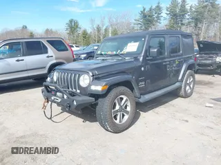 2018 Jeep Wrangler Unlimited Sahara with VIN 1C4HJXEG0JW246110, listed as a IAAI auction lot 41826662 with 65,236 mi miles. Bid and sale history available at carsss.com. Image 2.