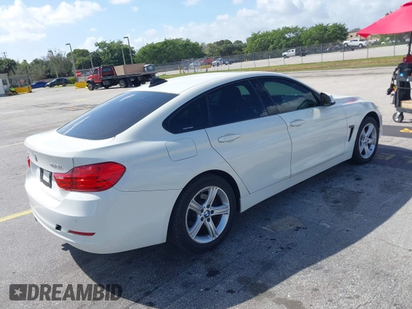 2015 BMW 4 Series 428i xDrive with VIN WBA4C9C56FG135520, listed as a IAAI auction lot 41574336 with 70,870 mi miles and . Bid and sale history available at carsss.com. Image 4.