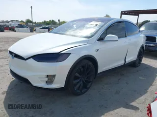 2021 Tesla Model X Long Range Plus with VIN 5YJXCBE23MF321243, listed as a IAAI auction lot 42100580 with 59,878 mi miles and . Bid and sale history available at carsss.com. Image 2.