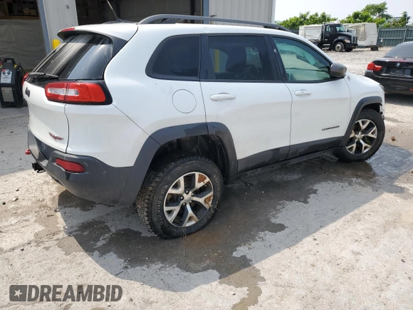 2015 Jeep Cherokee Trailhawk with VIN 1C4PJMBS8FW717950, listed as a Copart auction lot 60321625 with 155,210 mi miles and Salvage title. Bid and sale history available at DreamBid. Image 3.