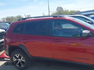 2016 Jeep Cherokee Trailhawk with VIN 1C4PJMBS9GW237059, listed as a IAAI auction lot 42079788 with 114,513 mi miles. Bid and sale history available at carsss.com. Image 14.