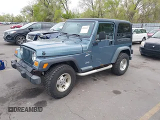 1998 Jeep Wrangler Sport with VIN 1J4FY19S8WP781437, listed as a IAAI auction lot 42096647 with 245,900 mi miles. Bid and sale history available at carsss.com. Image 2.