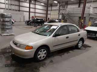 1998 Mazda Protege DX z VIN JM1BC1419W0171802, wystawiony jako IAAI lot #42202861 z przebiegiem 252 304 mil mil oraz . Historia ofert i sprzedaży dostępna na DreamBid. Obrazek 17.