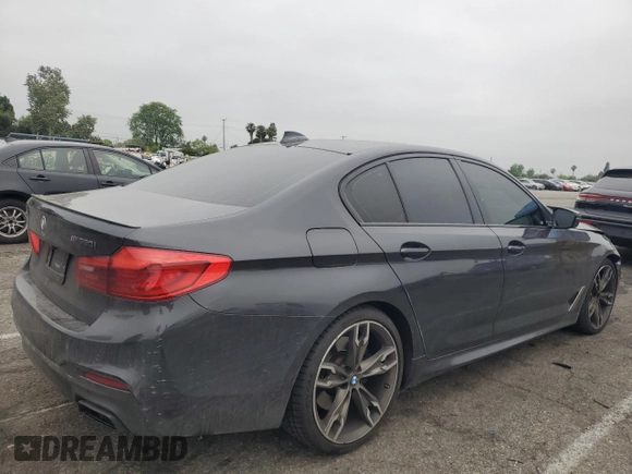 2019 BMW 5 Series M550i xDrive with VIN WBAJB9C59KB287501, listed as a Copart auction lot 59732425 with 74,345 mi miles and Salvage title. Bid and sale history available at DreamBid. Image 3.