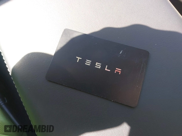 2023 Tesla Model 3 Long Range with VIN 5YJ3E1EB9PF393622, listed as a IAAI auction lot 41207132 with 14,097 mi miles and . Bid and sale history available at DreamBid. Image 11.