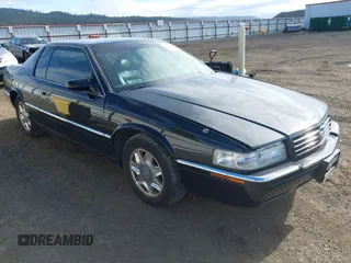 1997 Cadillac Eldorado Touring ETC z VIN 1G6ET1291VU601113, wystawiony jako IAAI lot #42250826 z przebiegiem 102 278 mil mil oraz . Historia ofert i sprzedaży dostępna na DreamBid. Obrazek 1.