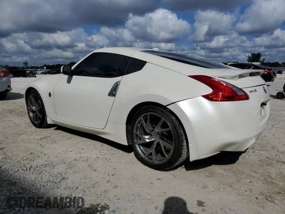 2014 Nissan 370Z Touring with VIN JN1AZ4EH6EM630690, listed as a Copart auction lot 43939795 with 66,797 mi miles and Salvage Title. Bid and sale history available at carsss.com. Image 2.