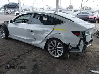 2020 Tesla Model 3 Long Range with VIN 5YJ3E1EB5LF801530, listed as a IAAI auction lot 41682050 with 65,743 mi miles. Bid and sale history available at carsss.com. Image 3.