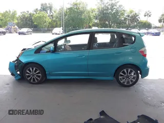 2013 Honda Fit Sport z VIN JHMGE8H54DC026019, wystawiony jako IAAI lot #42125500 z przebiegiem 139 285 mil mil oraz . Historia ofert i sprzedaży dostępna na DreamBid. Obrazek 14.