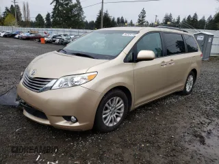 2011 Toyota Sienna XLE AAS with VIN 5TDYK3DC7BS124835, listed as a Copart auction lot 52324145 with 119,260 mi miles and Salvage Title. Bid and sale history available at carsss.com. Image 1.