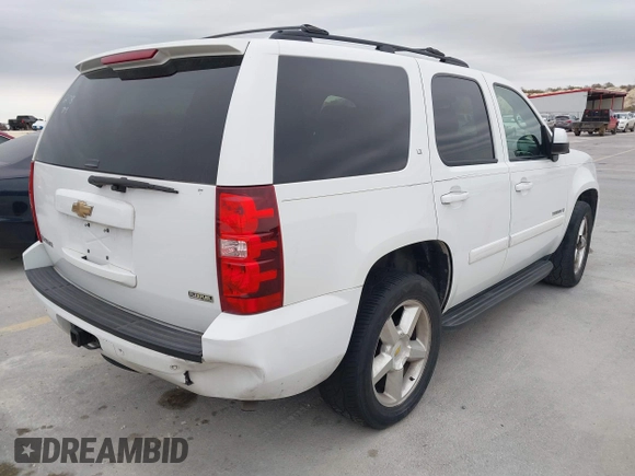 2007 Chevrolet Tahoe LTZ with VIN 1GNFC13027J402178, listed as a IAAI auction lot 41605898 with 203,677 mi miles and . Bid and sale history available at DreamBid. Image 4.