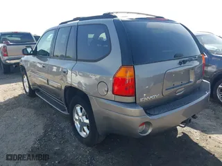2005 GMC Envoy SLE with VIN 1GKDS13S452306939, listed as a IAAI auction lot 41931667 with 236,955 mi miles. Bid and sale history available at carsss.com. Image 3.