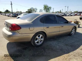 2003 Ford Taurus SES Standard z VIN 1FAFP55253G138373, wystawiony jako Copart lot #57124335 z przebiegiem 89 136 mil mil oraz Szkoda całkowita • Salvage title. Historia ofert i sprzedaży dostępna na DreamBid. Obrazek 3.