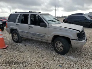 1998 Jeep Grand Cherokee with VIN 1J4FX48S6WC345358, listed as a Copart auction lot 85057454 with Not provided miles and Salvage title. Bid and sale history available at DreamBid. Image 4.