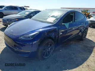 2024 Tesla Model Y Long Range with VIN 7SAYGDEE5RA329172, listed as a IAAI auction lot 41892147 with 8,030 mi miles and . Bid and sale history available at DreamBid. Image 2.