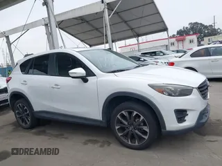 2016 Mazda CX-5 Grand Touring with VIN JM3KE4DY7G0737232, listed as a IAAI auction lot 42158279 with Not Provided miles and . Bid and sale history available at DreamBid. Image 13.