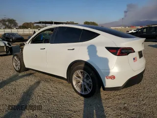 2023 Tesla Model Y Long Range with VIN 7SAYGDEE9PA129876, listed as a Copart auction lot 41819605 with 36,110 mi miles and Salvage Title. Bid and sale history available at DreamBid. Image 2.