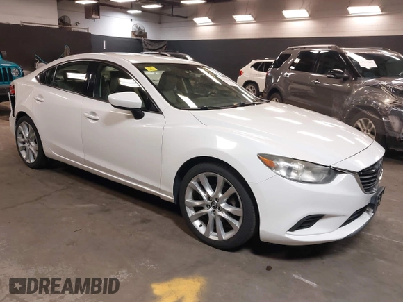 2014 Mazda Mazda6 i Touring with VIN JM1GJ1V68E1147067, listed as a IAAI auction lot 42105878 with 102,684 mi miles. Bid and sale history available at carsss.com. Image 1.