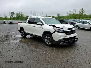 2017 Honda Ridgeline RTL-E with VIN 5FPYK3F72HB002890, listed as a Copart auction lot 57699735 with 128,813 mi miles and Salvage title. Bid and sale history available at DreamBid. Image 14.